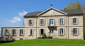 A Napoleon III-style manor house with pediment, balcony, upstairs terrace and numerous fireplaces.