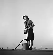 A Fire Guard in London, 1941, wearing a Zuckerman helmet.