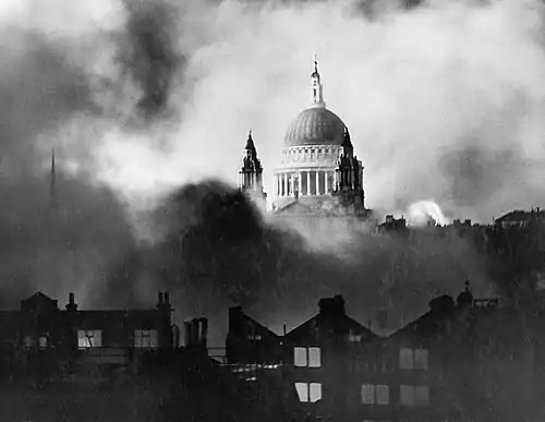 Black and white image of St Paul's Cathedral while London burns