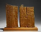 Arm panel from a ceremonial chair of Thutmose IV depicting the king seated with Thoth and a lioness-headed goddess, now in the Metropolitan Museum of Art