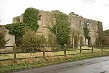 A ruined building with ivy growing on the walls