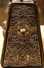 Interlace patterns on a side of St. Patrick's Bell Shrine; the earliest, most elaborate and best preserved surviving example. National Museum of Ireland (NMI).
