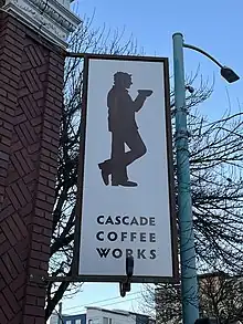 Photograph of a sign on the exterior of a building