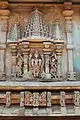 Decorative miniature decorative towers over deity relief sculpture on outer wall of Chennakeshava temple at Hullekere