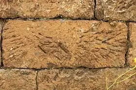 Convict-built embankment, Mount McQuoid, Great North Road, Bucketty, NSW. Distinctive markings on cut stones have been used in archaeological studies to estimate the number of convicts in an 'ironed-gang' i.e. offenders sentenced to work in chains, or other metal restraining devices, on heavy labouring tasks like road-making. There are recognisable and recurring patterns, attributable to individual stone-cutters.