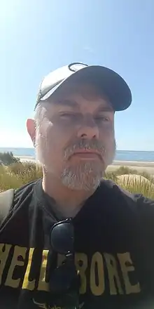 A portrait of John Reppion in August 2023.