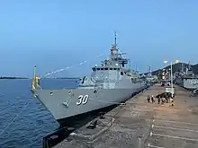 KD Lekiu docked at RMN Lumut Naval Base at night.