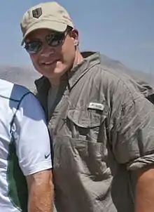 Mangini posing with sunglasses