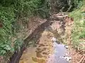 Garbage and aggradation in the Caladinho Stream between the Aparecida do Norte and Morada do Vale neighborhoods.