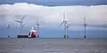 MV Vos Paradise in front of Scroby Sands wind farm