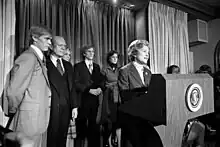 Ford reads her husband's 1976 presidential concession speech to the press.