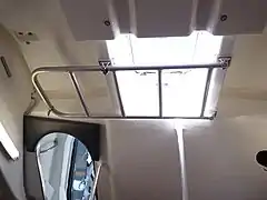 Deckhead escape hatch with drop-down ladder looking aft