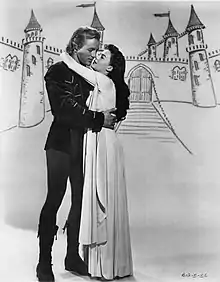 A black and white still of Wood on the right and Jacques Sernas on the left from the television episode The Deadly Riddle