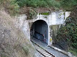 A concrete portal of an arched tunnel