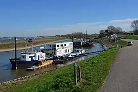 The Waalriver with a harbour and industrial activities