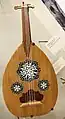 Egyptian oud with common triple soundhole shams (rose) design.