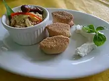 Traditional full Filipino breakfast with kesong puti, pandesal, sinangag (garlic rice), and a longganisa sausage