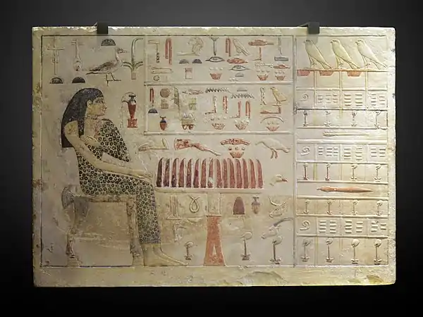 Stele of Princess Nefertiabet eating; 2589–2566 BC; limestone & paint; height: 37.7 cm, length: 52.5 cm, depth: 8.3 cm; from Giza; Louvre (Paris)