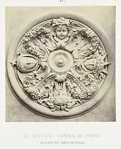 Neoclassical mascarons in a round ceiling ornament that depicts the four cardinal points, designed by Charles Garnier, c.1860–1875