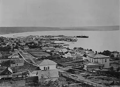 Looking south from Pine Street on the south slope of Denny Hill, 1880. The wide bay at the foot of Beacon Hill is now the location of the SoDo neighborhood.