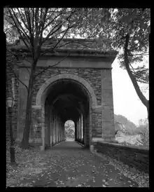 Side elevation of Billings Arcade and Drive as seen from Billings Drive northbound lane to Fort Tryon Park, looking south