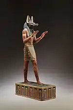 Statuette of Anubis; 332–30 BC; plastered and painted wood; 42.3 cm; Metropolitan Museum of Art