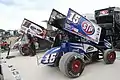 Steve Kinser and Donny Schatz sprint cars in the pits.