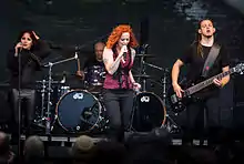The Gentle Storm live at the 2015 Wacken Open Air. From left to right: Marcela Bovio, Ed Warby, Anneke van Giersbergen and Johan van Stratum