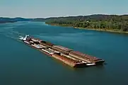 Towboat Dakota Storm upbound on Ohio River at Matthew E. Welsh Bridge (1 of 4), near Mauckport, Indiana, USA, 1987