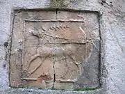 Ceramic tile with deer design.