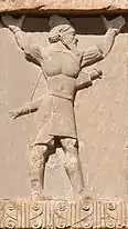 Hindush soldier, circa 480 BCE. He wears a Dhoti and a turban. Tomb of Xerxes I.